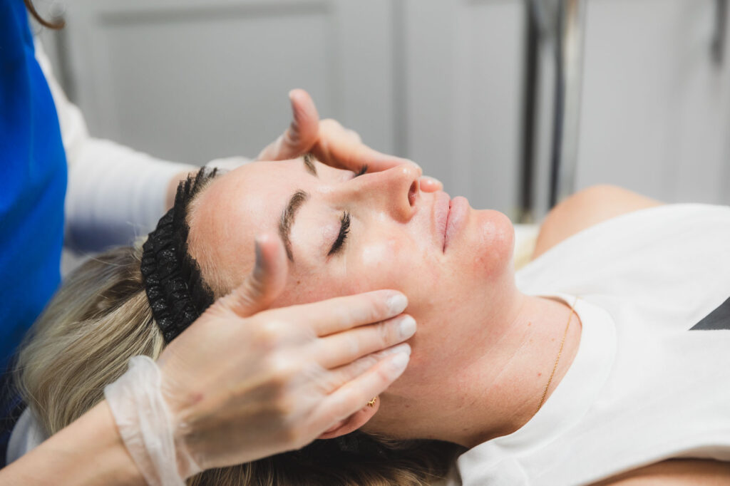 woman receiving a chemical peel to treat oily skin