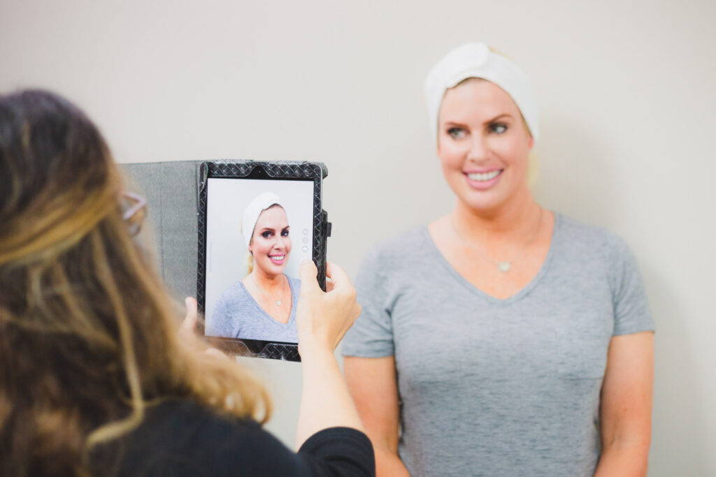 woman taking before picture ahead of her aestheticare appointment for juvederm in kansas city