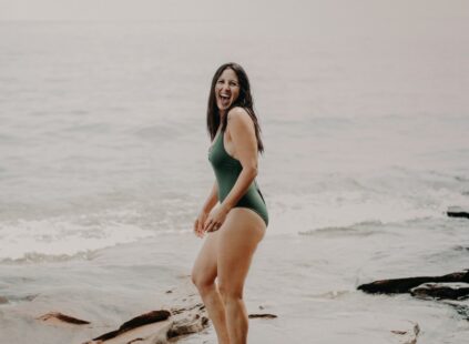 woman at the beach with energy from b12 supplement provider in Kansas City