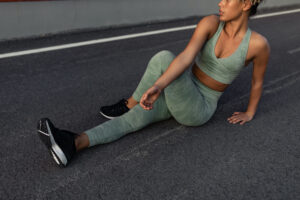 toned woman stretching
