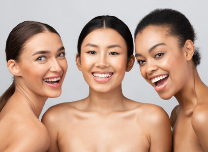 three joyful models smiling with dermal filler