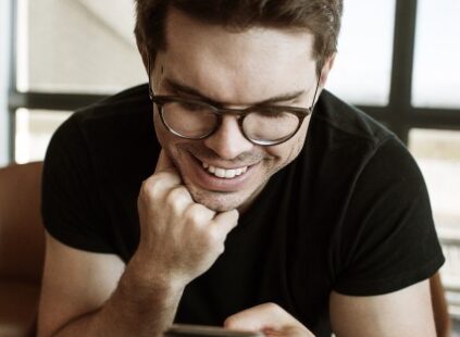 man reading about the best way to take vitamin B12